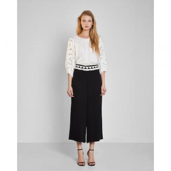 Pantalón palazzo fluido con cinturón de flecos