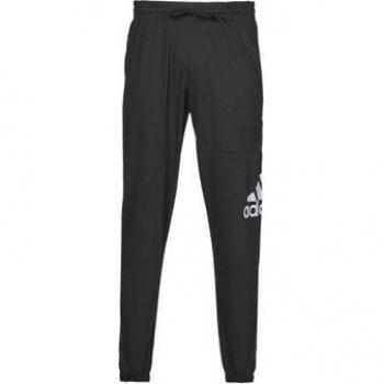 Pantalón largo adidas Essentials Logo para hombre, color negro, con diseño tapered y logotipo distintivo