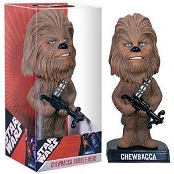 Figura Cabezón de Chewbacca de la saga de La Guerra de las Galaxias. La figura mide 15 cm.<br><br>Presentada ilustrada con ventana.<br>