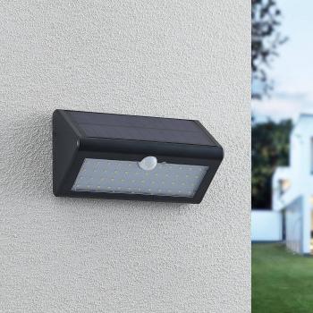 Aplique solar exterior LED Lindby Ladiro con sensor, moderno, color negro, hecho de plástico, 1 llama