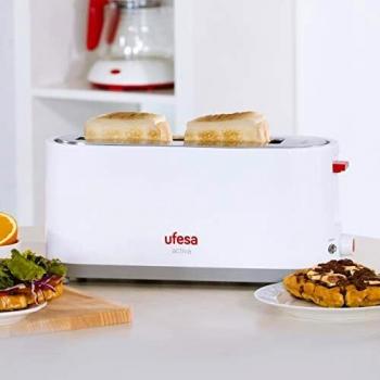 Tostador Ufesa TT7365, potencia 900W, 3 funciones: Descongelar, recalentar y cancelar, con bandeja recogemigas y selector electrónico de 7 posiciones de tostado. Dispone de ranuras de gran anchura.