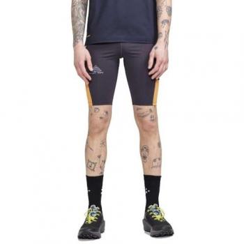 Malla corta Craft Pro Trail negra y naranja - XXL, malla corta para running, tejido transpirable, tecnología de gestión de humedad, cintura elástica con cordón ajustable, bolsillos laterales con cremallera