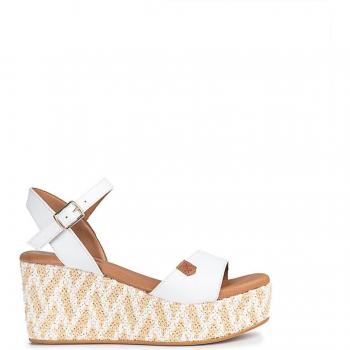 Sandalias de cuña en piel atadas con hebilla