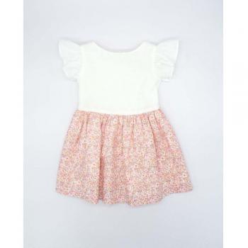 Vestido cuerpo plumeti blanco y falda de flores con lazo en la espalda