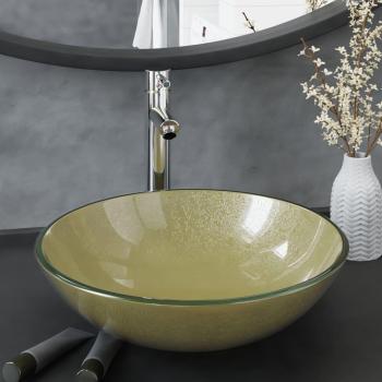 Lavabo con grifo y tapón pulsador de cristal templado dorado.