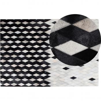 Alfombra de piel negra y blanca 140 x 200 cm moderna patchwork hecha a mano